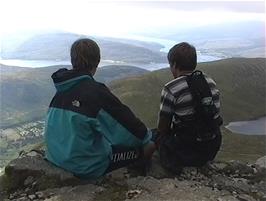 Gavin and Luke pause for a rest during the descent to enjoy the views exposed by the lifting cloud